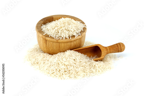 Long-grain rice in wooden bowl and wooden scoop