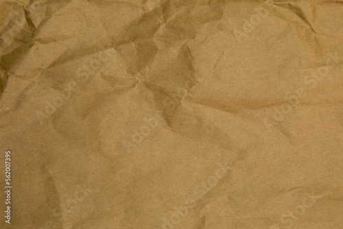 Brown wrinkle paper background texture. Brown template. Brown paper background.