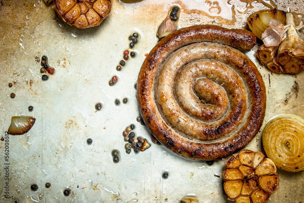 Fried sausages with garlic and onions. Fried sausages with garlic and onions.