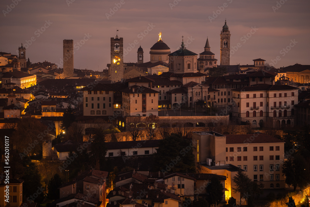 Fototapeta premium Bergamo. One of the beautiful city in Italy. Landscape at the old town from the hill at evening. Amazing view of the towers, bell towers and main churches. Touristic destination. Best of Italy