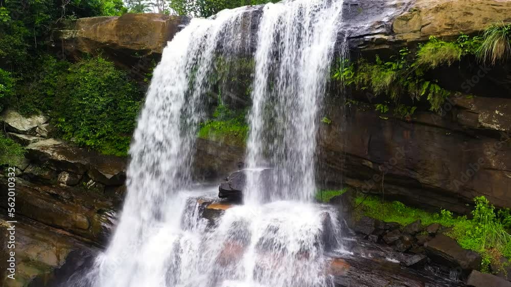 Waterfall in the rainforest, jungle. Aerial drone of Thaliya Wetuna Falls, Sri Lanka Waterfall in the rainforest, jungle. Aerial drone of Thaliya Wetuna Falls, Sri Lanka