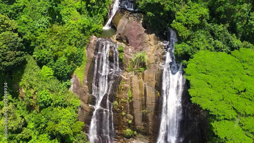 Top view of Beautiful waterfall in green forest. Tropical Hunnasgiriya Falls in mountain jungle, Sri Lanka. Top view of Beautiful waterfall in green forest. Tropical Hunnasgiriya Falls in mountain jungle, Sri Lanka.