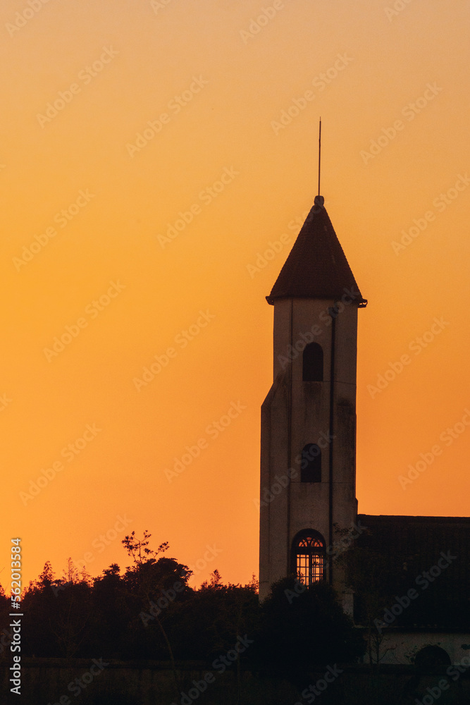 Church buildings in the setting sun