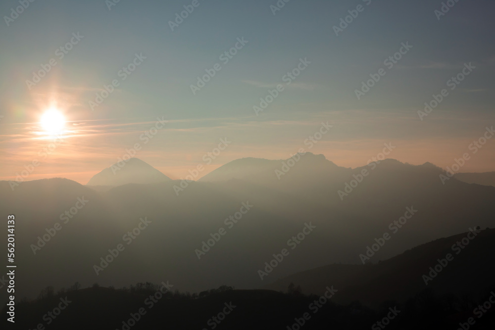 sunset in the Carpathian mountains on a foggy evening