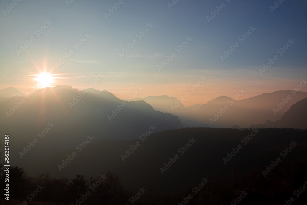 sunset in the mountains with fog