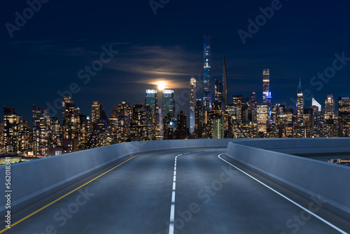 Empty urban asphalt road exterior with city buildings background. New modern highway concrete construction. Concept of way to success. Transportation logistic industry fast delivery. New York. USA.