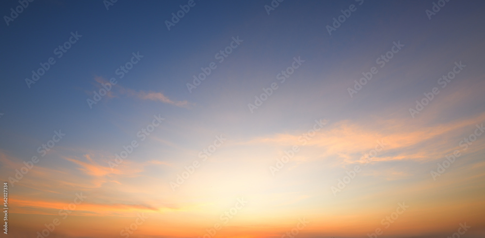 Panoramic view of dawn sky in country field.
