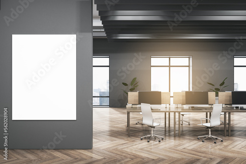 Modern dark concrete and wooden coworking office interior with empty mock up banner on wall  furniture  equipment  window with city view and sunlight. Workplace and loft space concept. 3D Rendering.