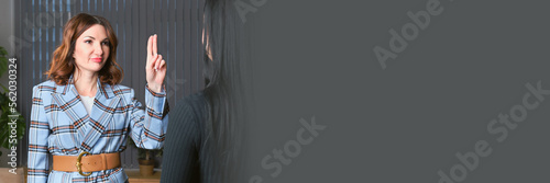 Cuadro en lienzo attractive business woman in a beige dress is talking on a mobile phone in her o