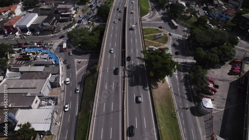 Drone shows traffic in a viaduct. Cars moving up and down the viaduct in Raposo Tavares road. photo