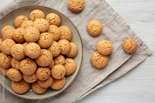 Homemade Italian Amaretti Cookie Biscuits on a Plate, top view. From above, overhead, flat lay.