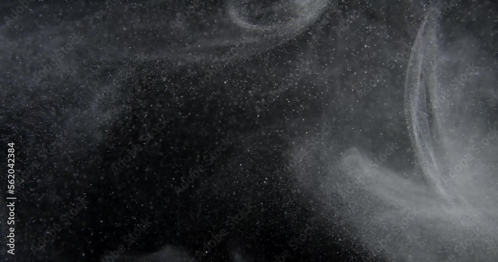 System of dust particles on black screen overlay. Filmed with RED camera in slow motion. Abstract shapes background. High quality 4k footage