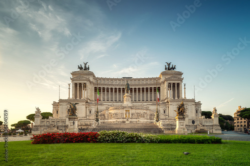Street view of National Monument Victor Emmanuel II or Vittoriano at Piazza Venezia in morning light, Rome, Italy