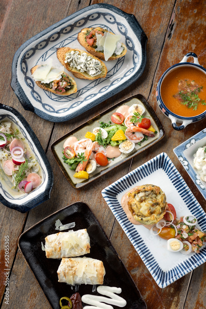 Fotografie selection of many different tapas on rustic wood table