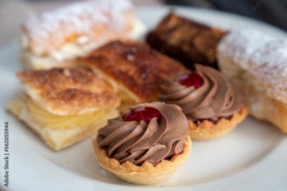 A delightful selection of sweet mini cakes consisting of finger pastries and little sweet bites A delightful selection of sweet mini cakes consisting of finger pastries and little sweet bites
