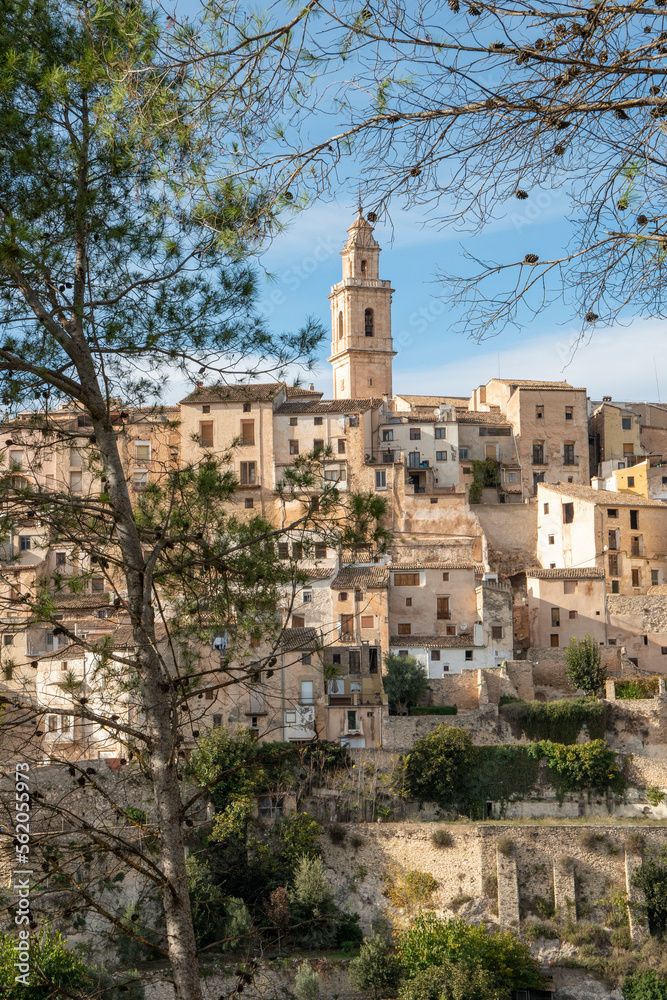 Panoramic image view to Bocairent village against rocky mountains and clear blue sky background. Comarca of Vall d`Albaida in Valencian Community, Spain