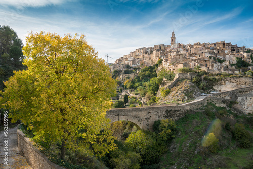 Panoramic image view to Bocairent village against rocky mountains and clear blue sky background. Comarca of Vall d`Albaida in Valencian Community, Spain photo