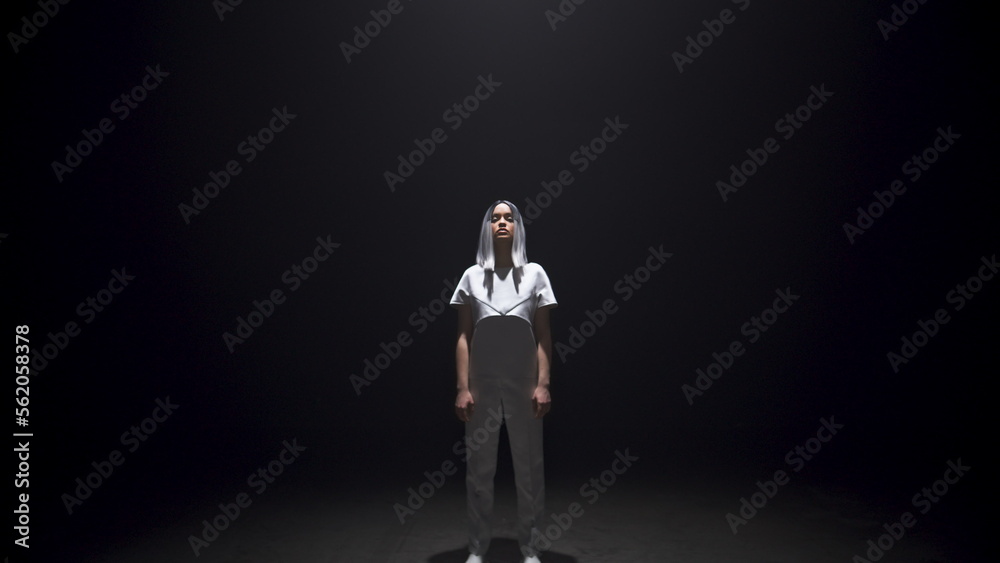 Futuristic girl posing dark room in light. Beautiful hipster with silver hair Futuristic girl posing dark room in light. Beautiful hipster with silver hair