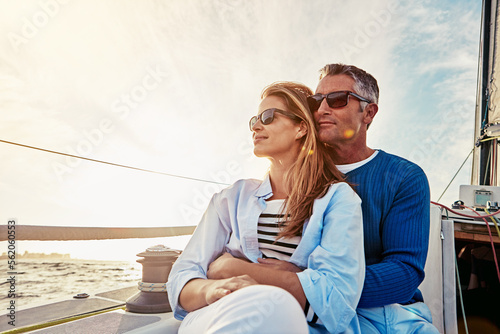 Yacht, travel and love with a mature couple sitting together on a boat out at sea for a romantic date. Luxury, ocean or summer with a married man and woman on a ship to relax during a trip © Reese/peopleimages.com