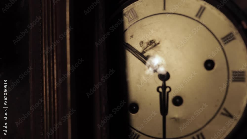 old dark antic clock face in old attic in big house