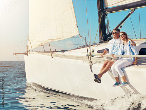 Luxury cruise, couple and yacht while on a boat trip at sea for a adventure, holiday or vacation in summer. Man and woman sailing together on a cruise ship on the ocean with love, happiness and care © Reese/peopleimages.com