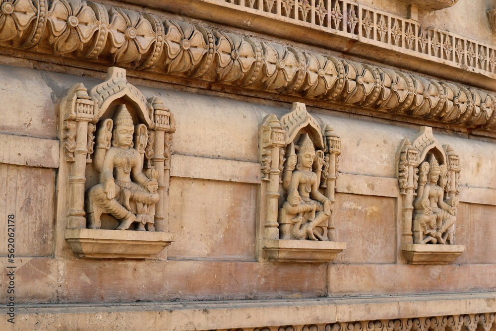 Image of various forms of the goddess Kali on the wall of a Hindu temple,  India.