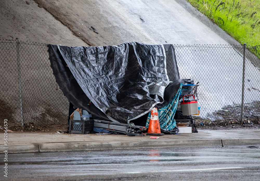 Homless shelter in the rain under a freeway bridge Stock Photo | Adobe ...