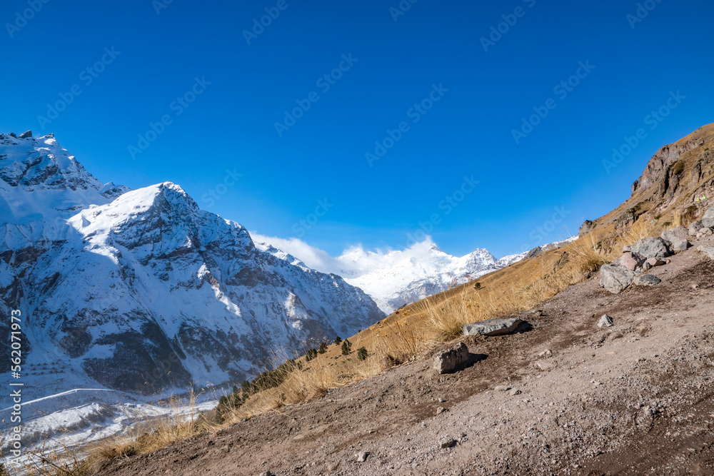 A walk along the slopes of the Caucasus Mountains on a January fine day in 2023. Kabardino-Balkarian Republic, Elbrus region