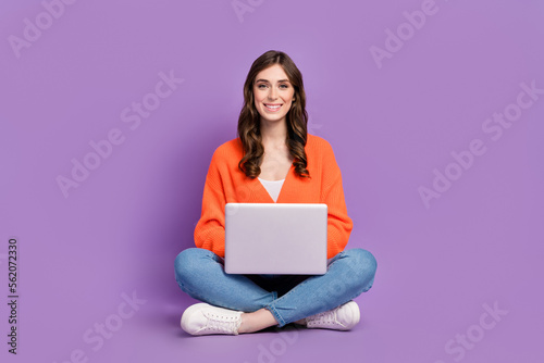 Full length photo of positive sweet woman dressed cardigan chatting instagram twitter facebook isolated purple color background