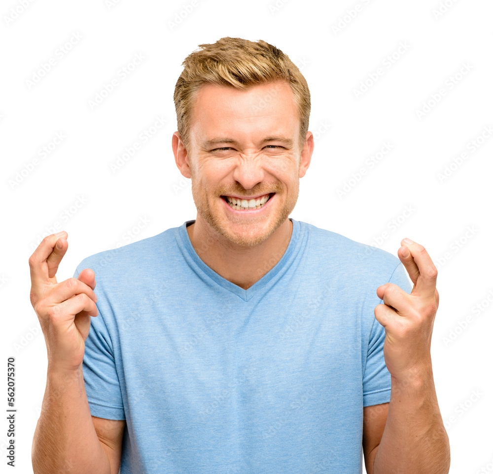 A handsome young man standing alone in the studio and feeling hopeful while crossing his fingers isolated on a PNG background. A handsome young man standing alone in the studio and feeling hopeful while crossing his fingers isolated on a PNG background.