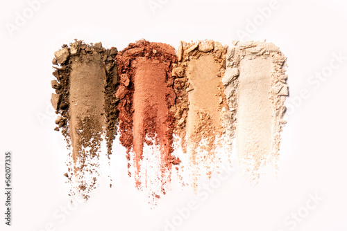 Makeup swatches palette of powder-brown, dark brown, skin color, and beige on a white background.