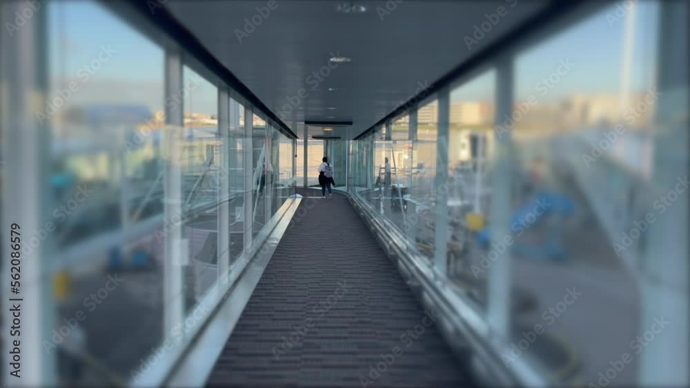 Passenger POV inside plane boarding bridge. Traveling flight concept transportation