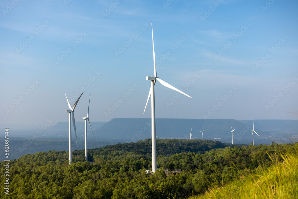 Windmill farm Generating electricity clean energy. Wind turbine farm generator by alternative green energy. Windmill farm Generating electricity clean energy. Wind turbine farm generator by alternative green energy.