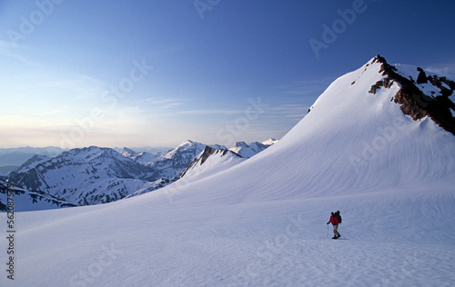 A ski mountaineer skis up a snow slope near Whistler, British Columbia, during a classic 3 day ski traverse of the Spearhead Mountain Range. photo