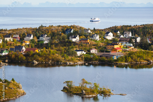 The ferry from Bodo passes the town of Sorvagen on Moskenesoya, Lofoten Islands, Norway. photo