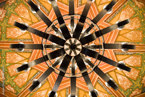 Detail of an ornate ceiling and chandelier in the old Riviera del Pacifico in Ensenada, Baja California, Mexico.
