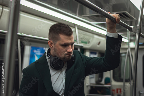 Fotografi man young male caucasian passenger one person sleepy tired go by subway transport in the morning