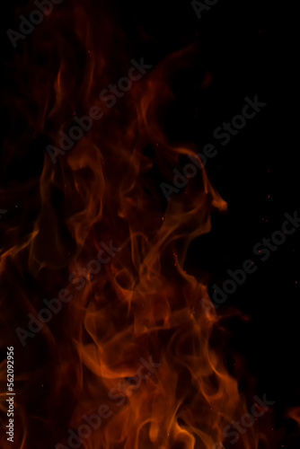 fire flames with sparks on a black background.