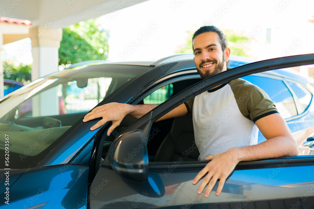 Handsome man going on a trip in his car Handsome man going on a trip in his car