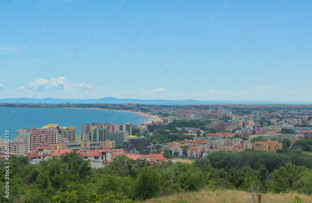 Landscape of a resort with hotels and parks on the coast of the sea with sandy beaches on a clear sunny day