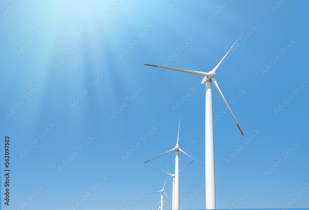 Wind power plant outside the city close-up against the blue sky. Wind power plant outside the city close-up against the blue sky.