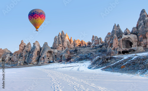 Hot air balloon flying over spectacular Cappadocia with lot of footprint - Goreme, Turkey