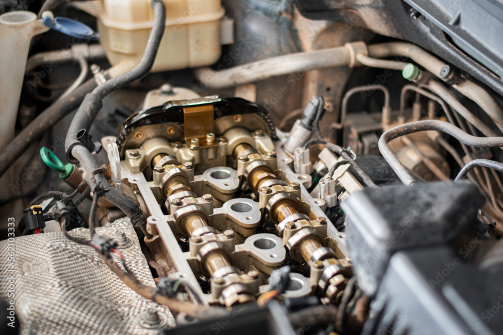 Car service, close up of open car engine at the maintenance garage. Auto service, close up. Car service, close up of open car engine at the maintenance garage. Auto service, close up.