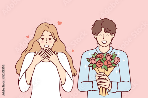 Romantic man holding flowers and happy woman delighted with gift bouquet from boyfriend. Girl in love feels happiness after receiving congratulations on birthday or Valentine Day. Flat vector design 