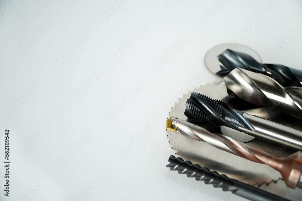 Drill tap for threading in a metal tool for metal processing on a white background,engineering concept Drill tap for threading in a metal tool for metal processing on a white background,engineering concept