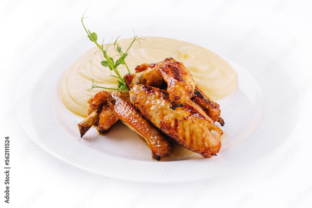Fried chicken wings and mashed potatoes on plate Fried chicken wings and mashed potatoes on plate