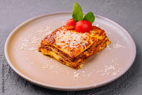 Traditional lasagna with bolognese sauce topped