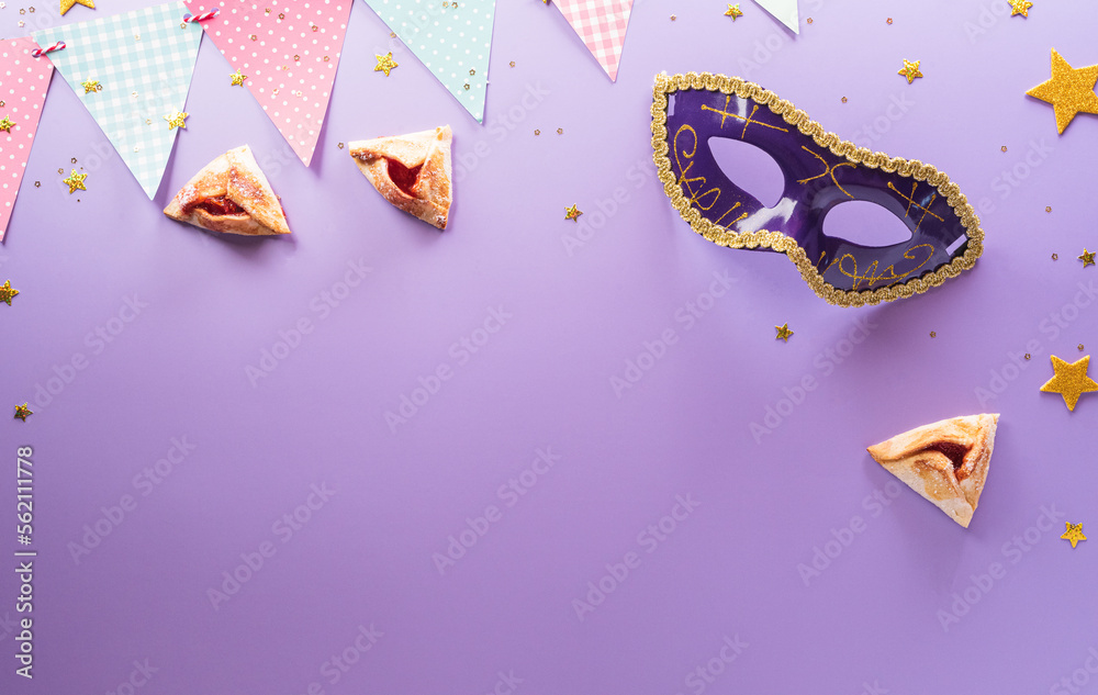 Happy Purim carnival decoration concept made from mask and sparkle star and hamantaschen cookies on pastel background. (Happy Purim in Hebrew, jewish holiday celebrate) - obrazy, fototapety, plakaty 