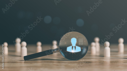 HRM ,Human Resource Management ,Strategic planning for success through people business development concept by choosing professional leaders employee competency ,a magnifying glass on the table photo