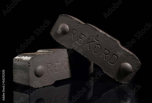 Coal Briquettes - Rekord Briquette isolated on black Background